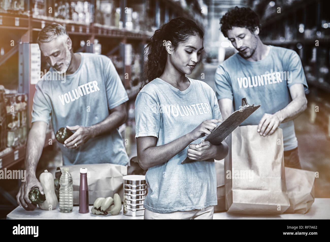 Volunteers working in a warehouse Stock Photo