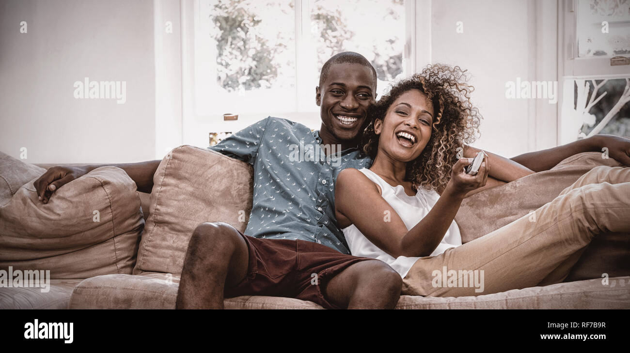 Young couple relaxing on the sofa Stock Photo