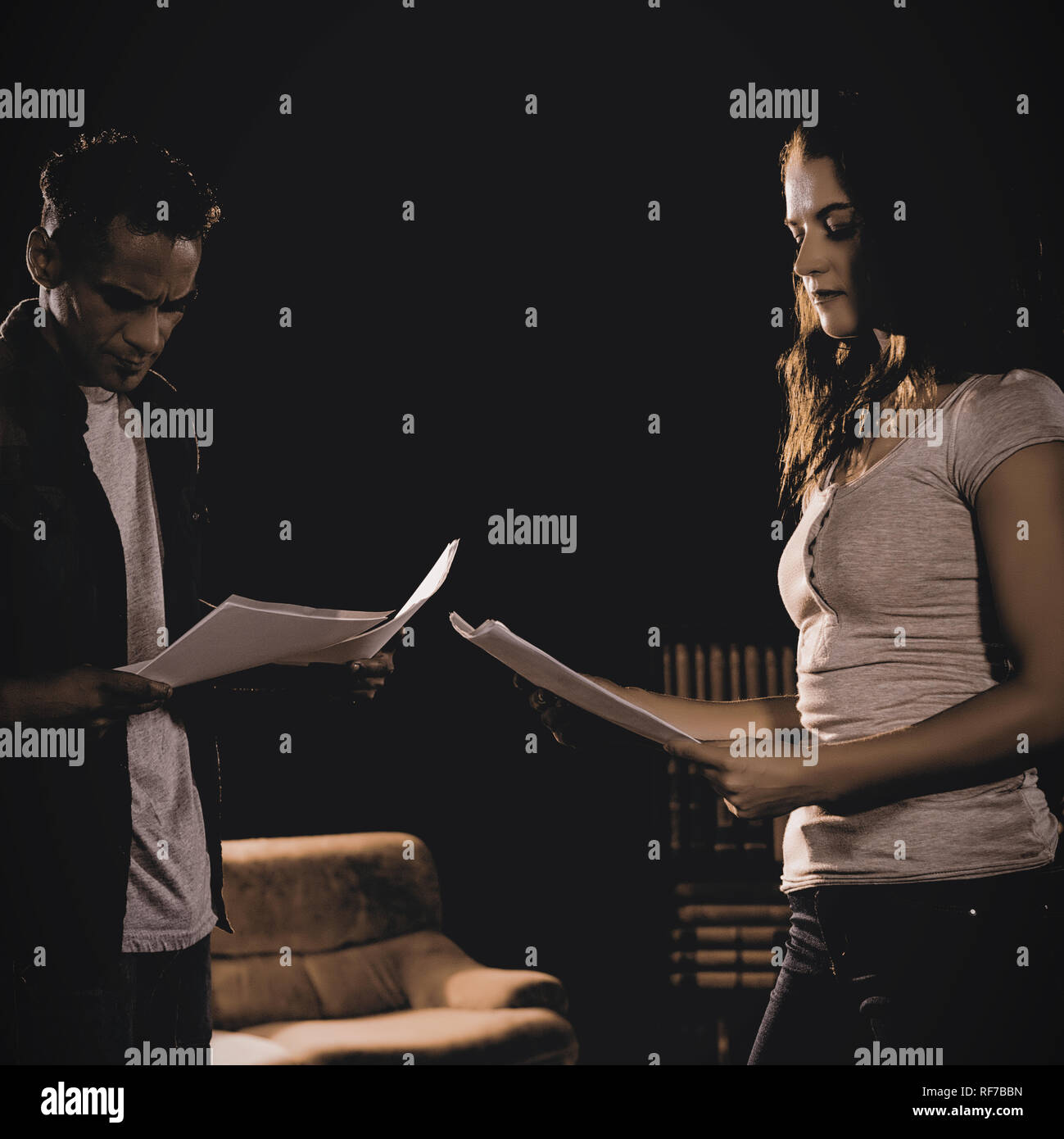 Actors reading their scripts on stage Stock Photo - Alamy