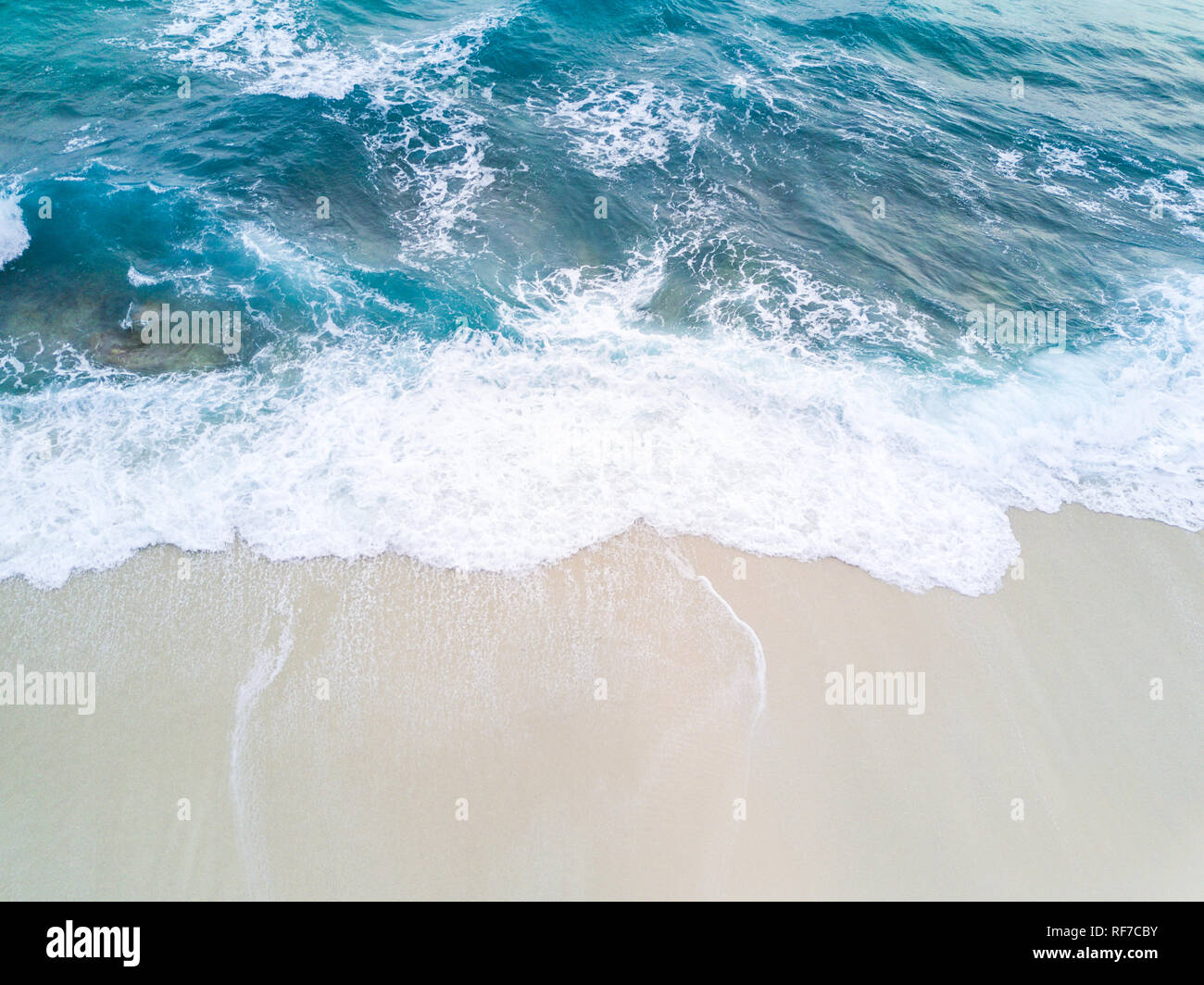 Waves break down in to shore Stock Photo