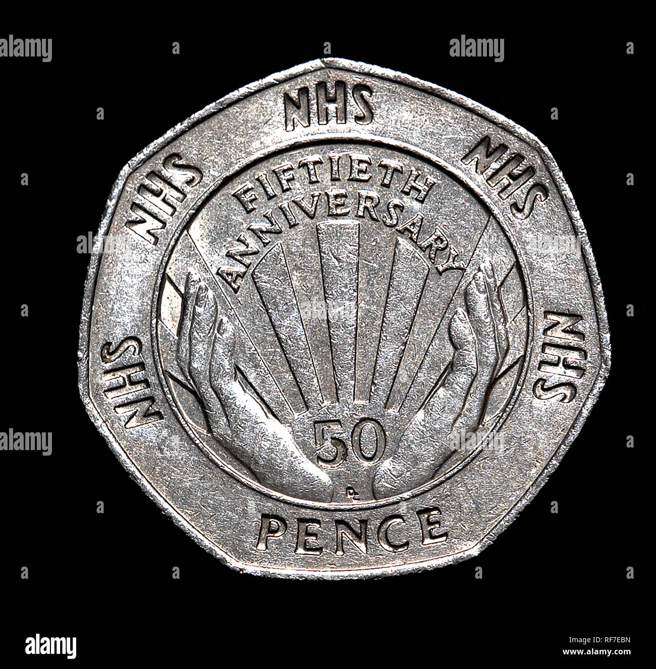 UK commemorative 50 pence coin celebrating the National Health Service. Stock Photo