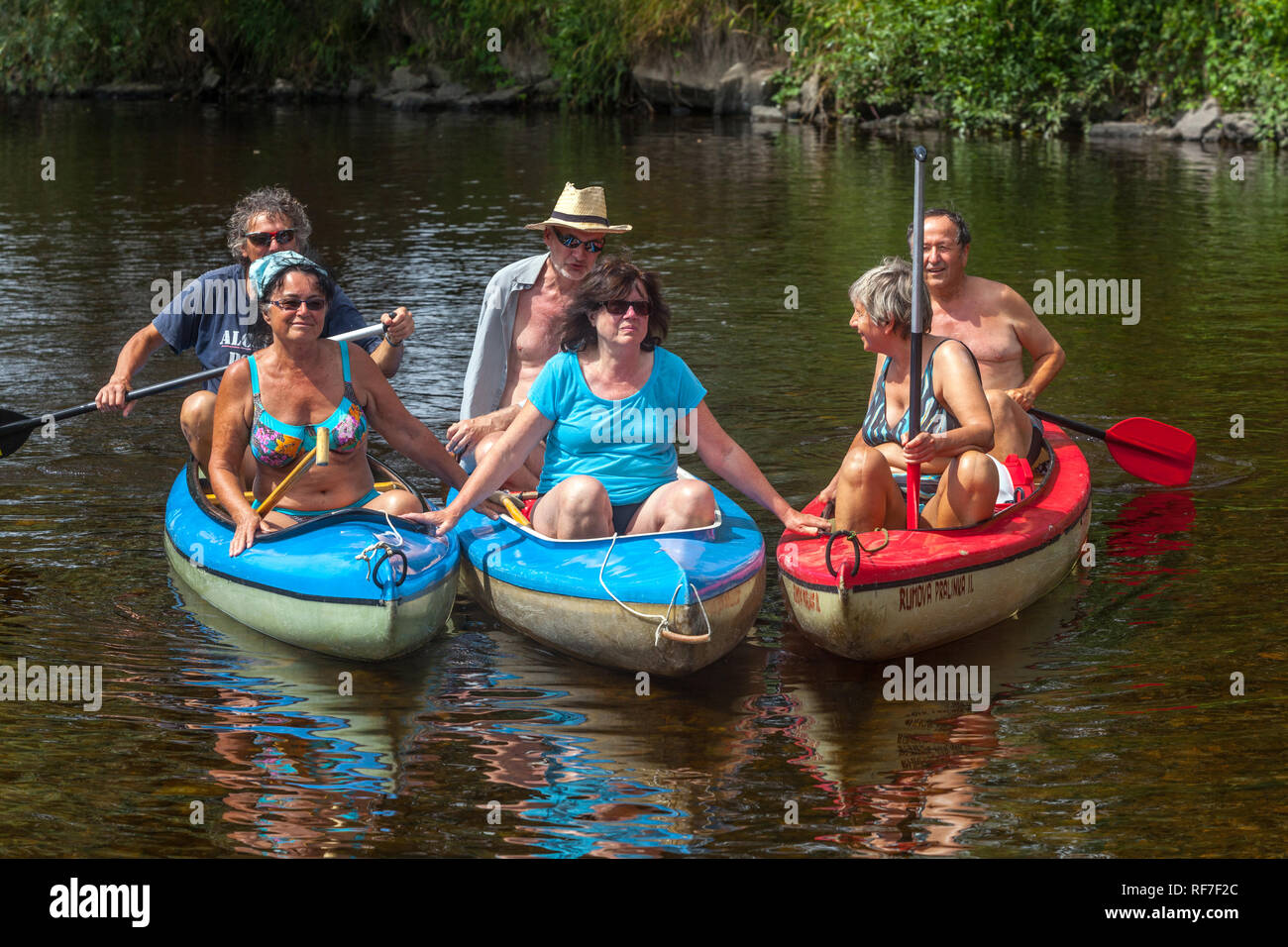 Active seniors people group, canoeing river Otava, South Bohemia, Czech Republic Stock Photo