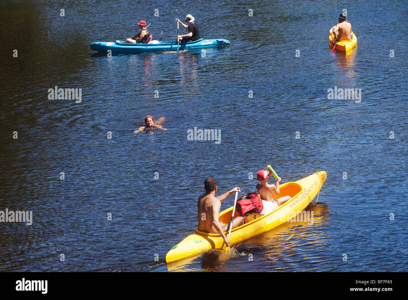 Active people canoeing river, canoes going down by Otava River, South Bohemia, Czech Republic Stock Photo