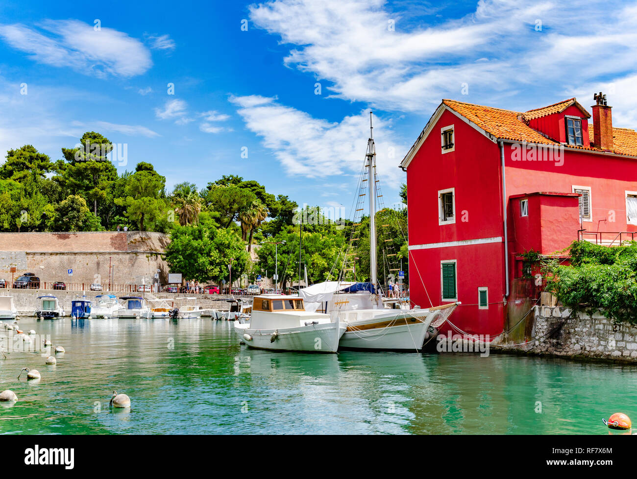 Boats and fishing boats on the pier in Fosa Bay in the spa town of