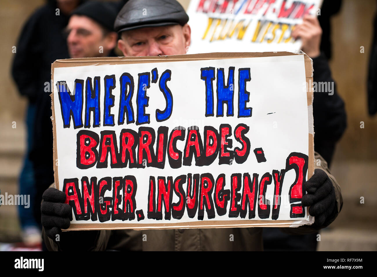 Angry group of anti-government anarchists demonstrators with banners, protesting against the state of the Brexit deal, at Portland Place, London, UK. Stock Photo