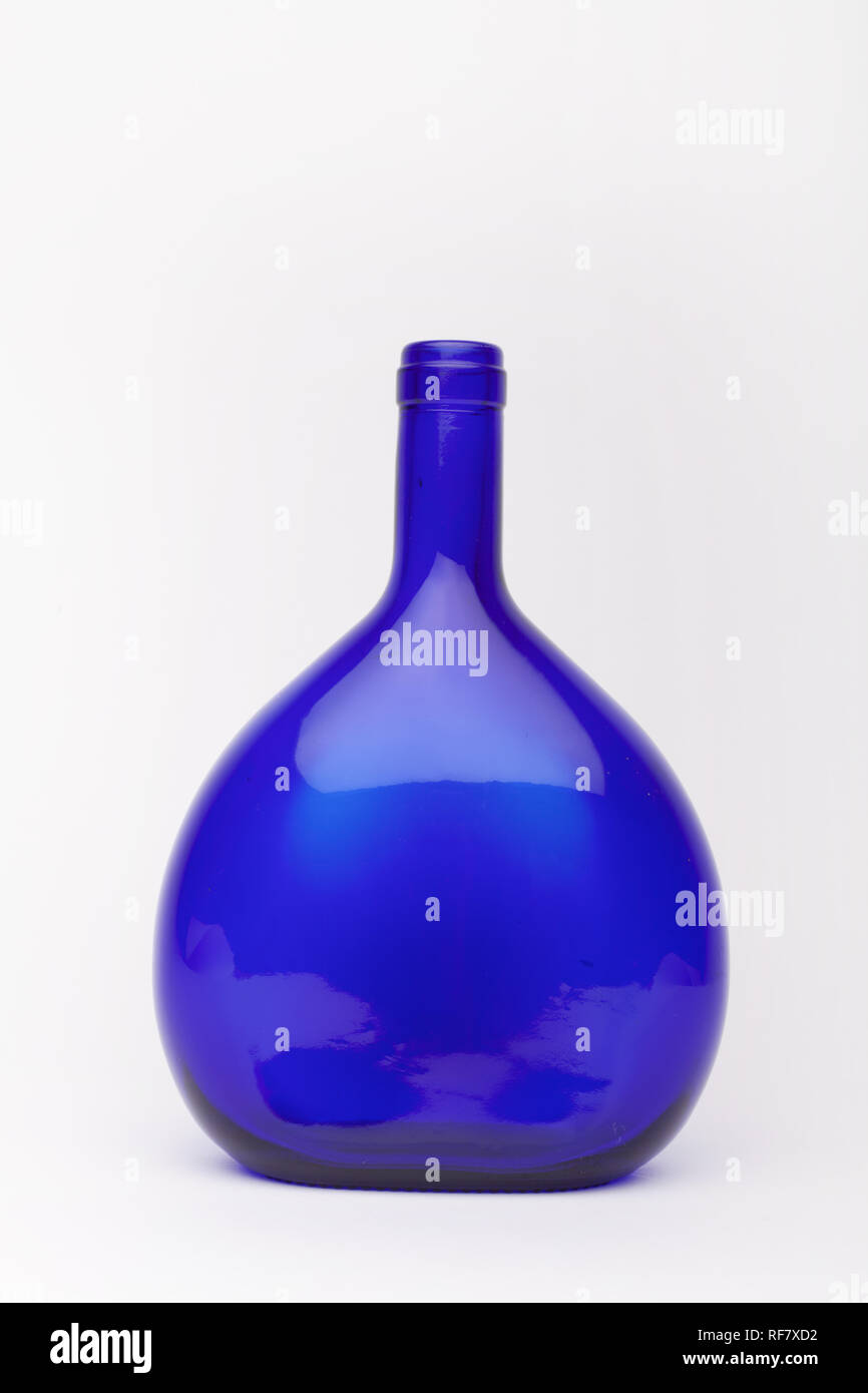 Blue wine bottle on the white background, isolated Stock Photo Alamy