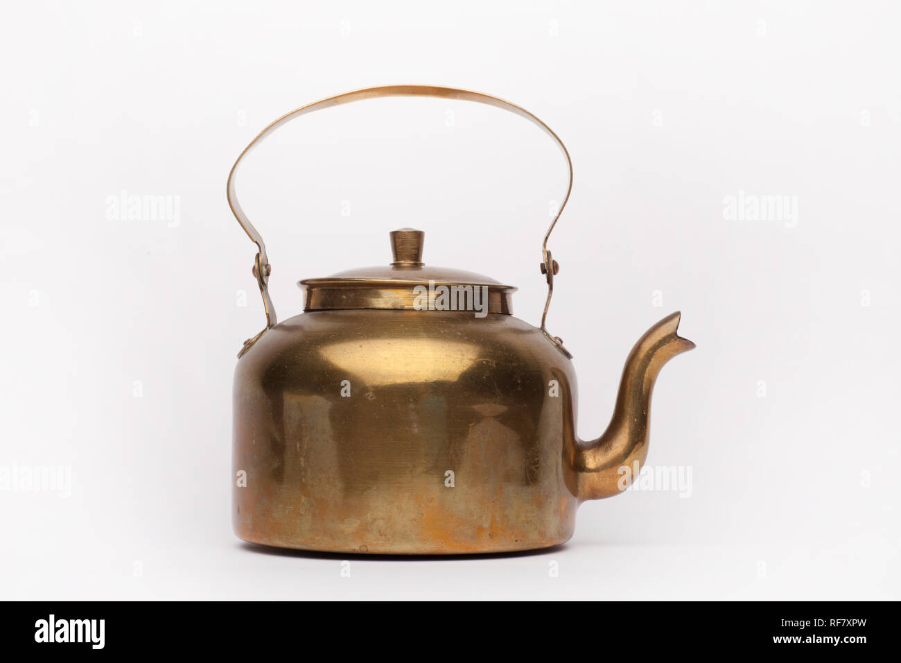 Old brass teapot on the white background, isolated Stock Photo - Alamy