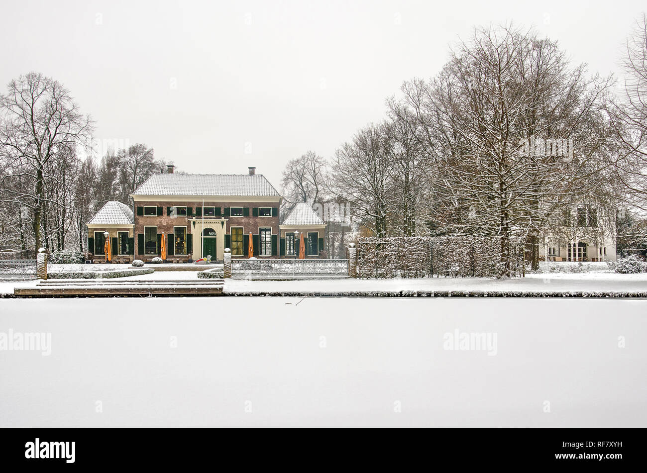 Rotterdam, January 22, 2019: the former Mansion and Coach House, now both restaurants/cafes, in a wintry landscape of the Park, on which snowflakes ar Stock Photo