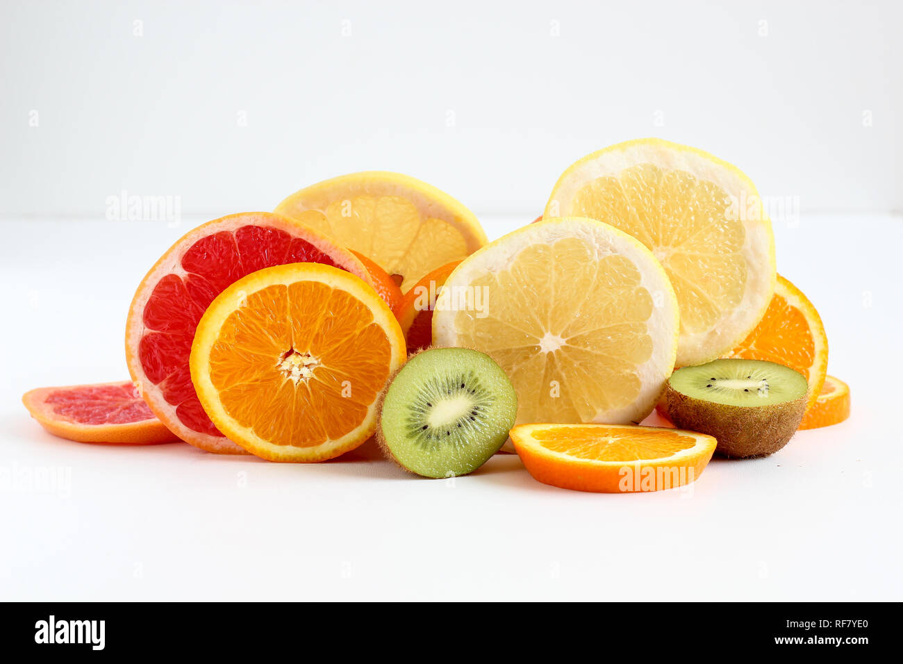 Layers of sliced fruits - kiwi, orange and grapefruits Stock Photo