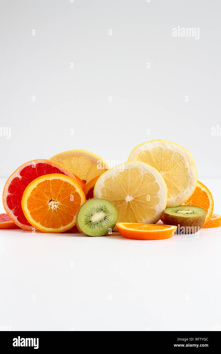 Layers of sliced fruits - kiwi, orange and grapefruits Stock Photo