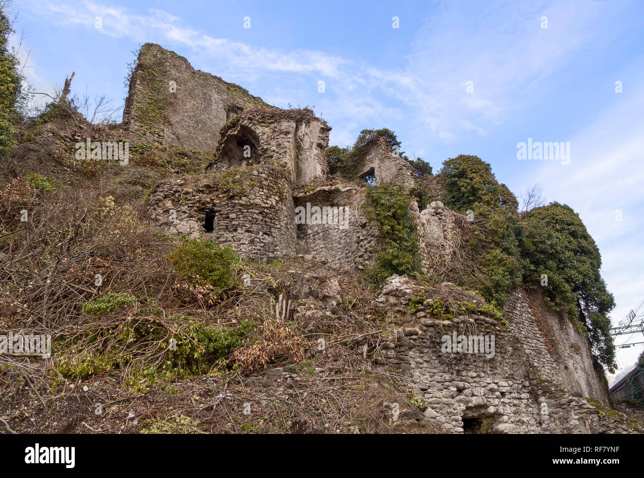 Section of the old Malnido castle ruins in Villafranca in Lunigiana, Italy. Removal of vegetation work in progress January 2019. Stock Photo