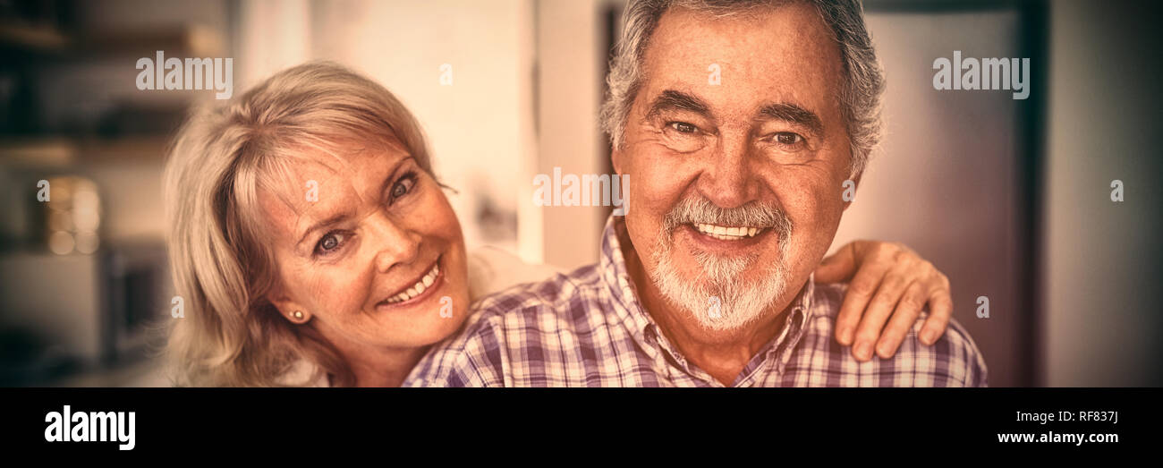 Couple hugging home hi-res stock photography and images - Alamy