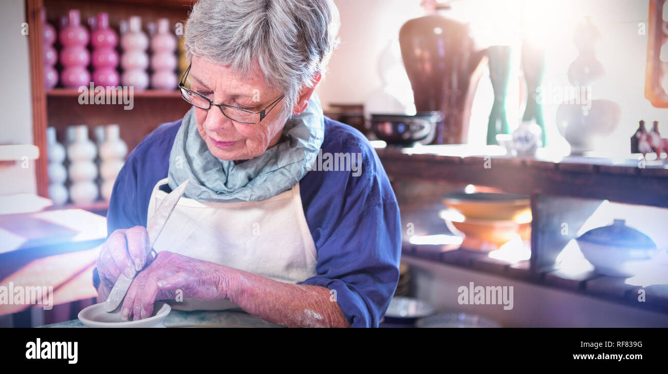 Female potter making pot Stock Photo