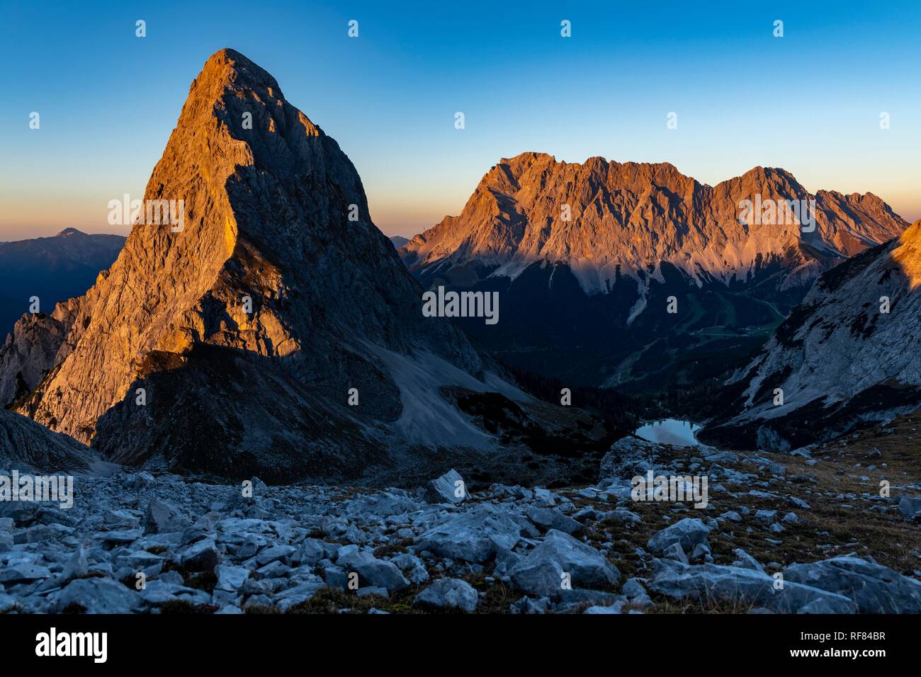 Summit of the Sonnenspitze with Zugspitze in the background at evening light, Ehrwald, Außerfern, Tyrol, Austria Stock Photo