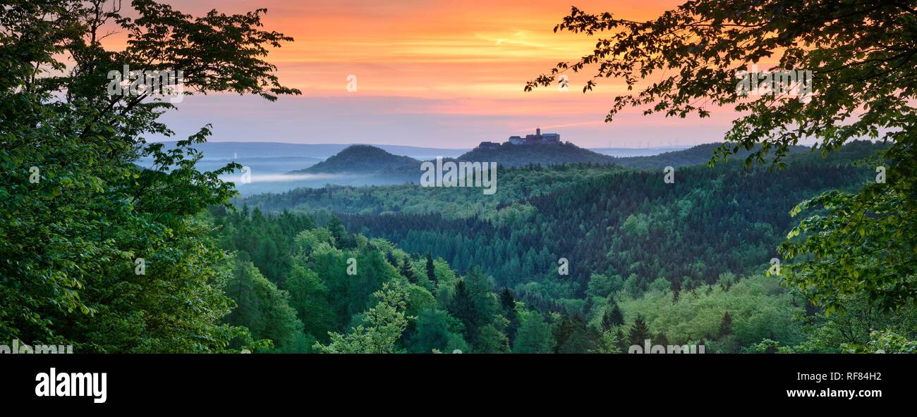 View from Rennsteig over the Thuringian Forest to Wartburg, Morgenrot, Morgennebel, near Eisenach, Thuringia, Germany Stock Photo