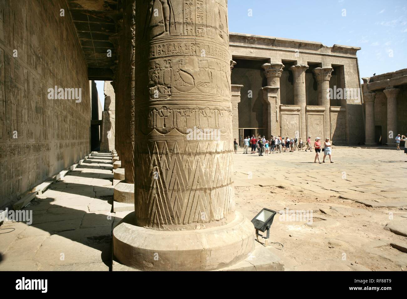 Tourists at the Temple of Edfu (dedicated to the falcon god Horus), Edfu, Egypt, Africa Stock Photo