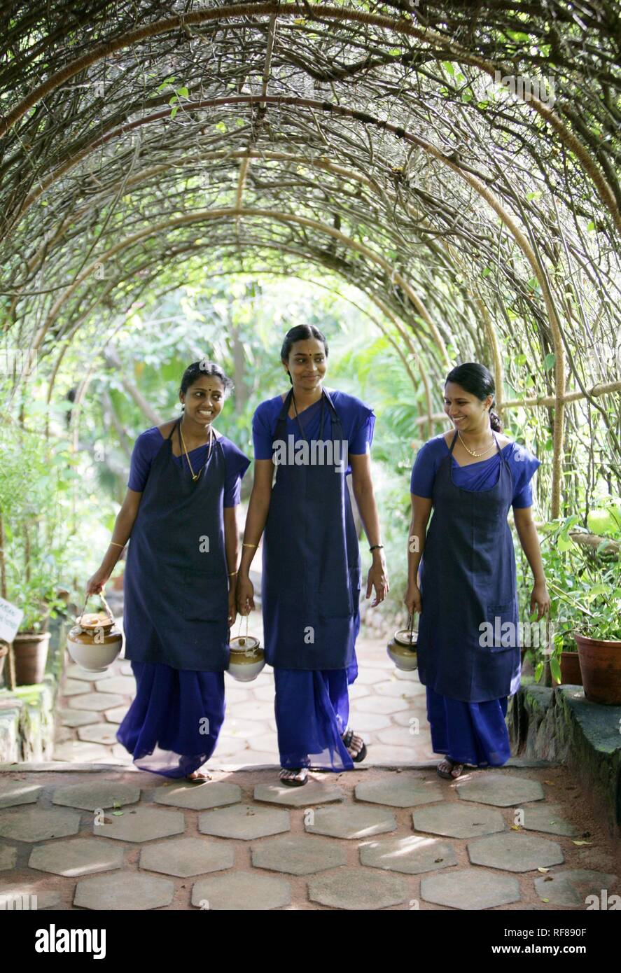 Therapists on their way to an oil treatment, Somatheeram Ayurveda