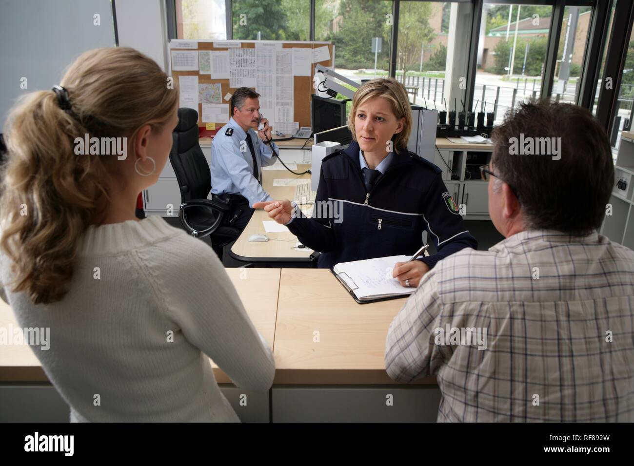 Police officers at the office, new blue police uniforms worn by 1400