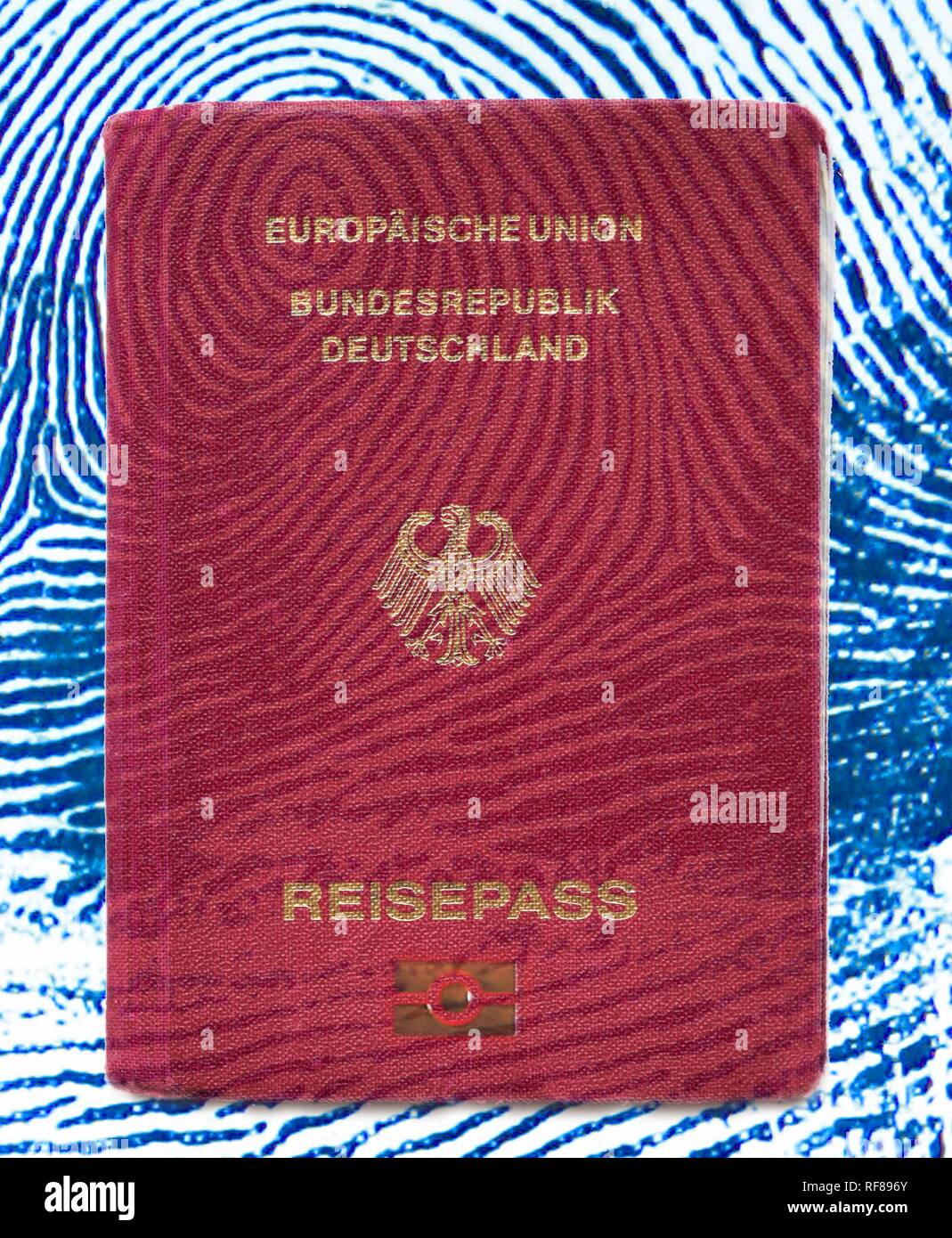 Symbolic photo: new German passport featuring advanced security features, digitalized data and fingerprints Stock Photo