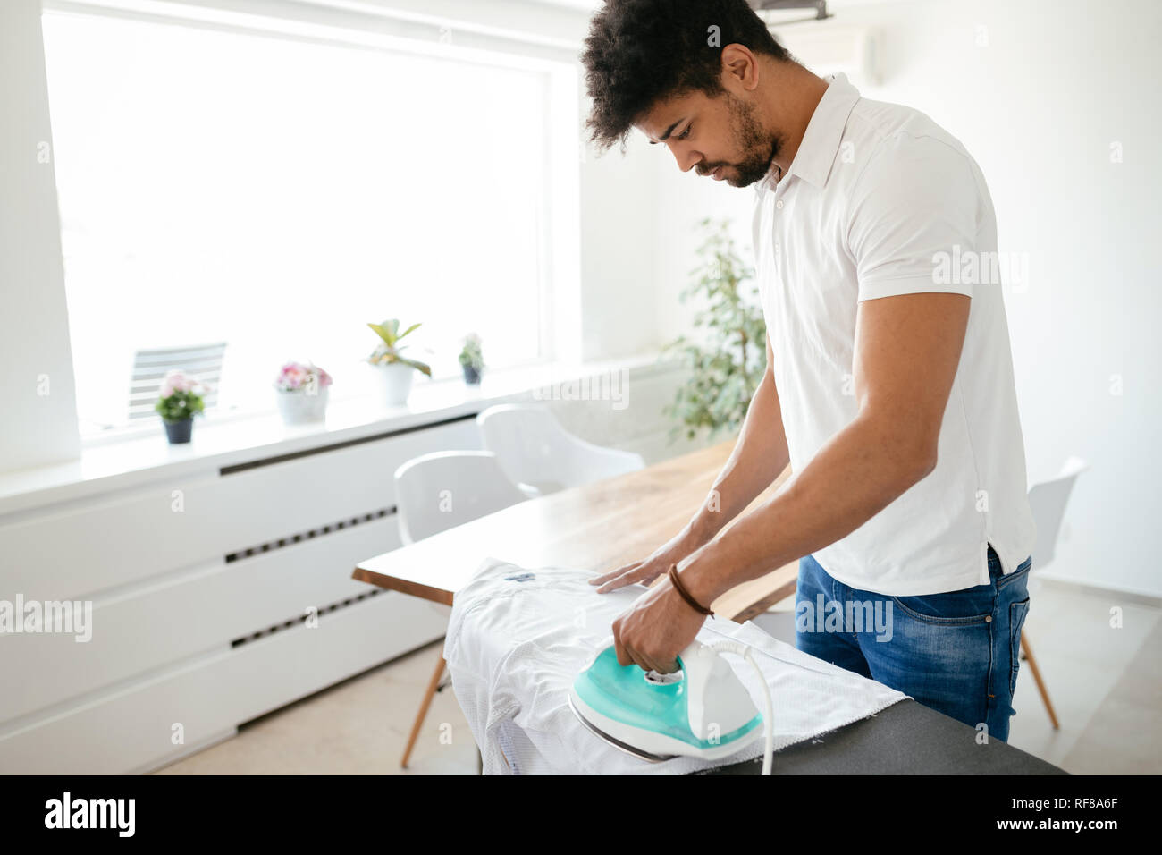 Man Ironing Cloth In Domestic Kitchen At Home Photo Background And Picture  For Free Download - Pngtree