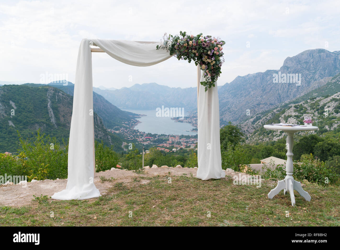 Beautiful Wooden Wedding Arch Decorated With Flowers Outdoors