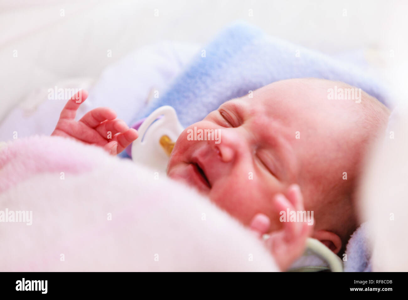 Infant care, beauty of childhood concept. Little newborn baby sleeping
