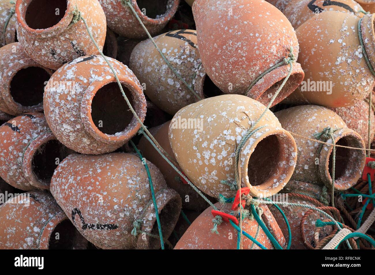 Clay pots for catching rock lobsters in Armacao de Pera, Algarve, Portugal Stock Photo