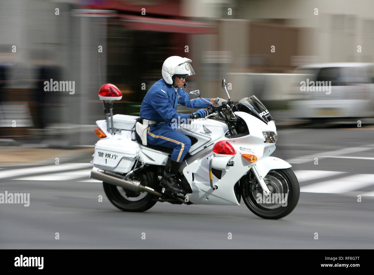 Street scene featuring police motorcycle, Tokyo, Japan, Asia Stock Photo