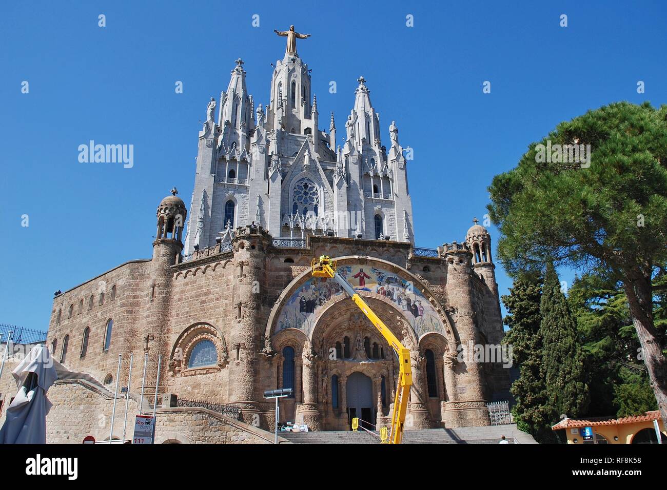 Maintenance work being carried out on the Temple of the Sacred Heart of Jesus on the summit of Mount Tibidabo in Barcelona, Spain on April 18, 2018. Stock Photo