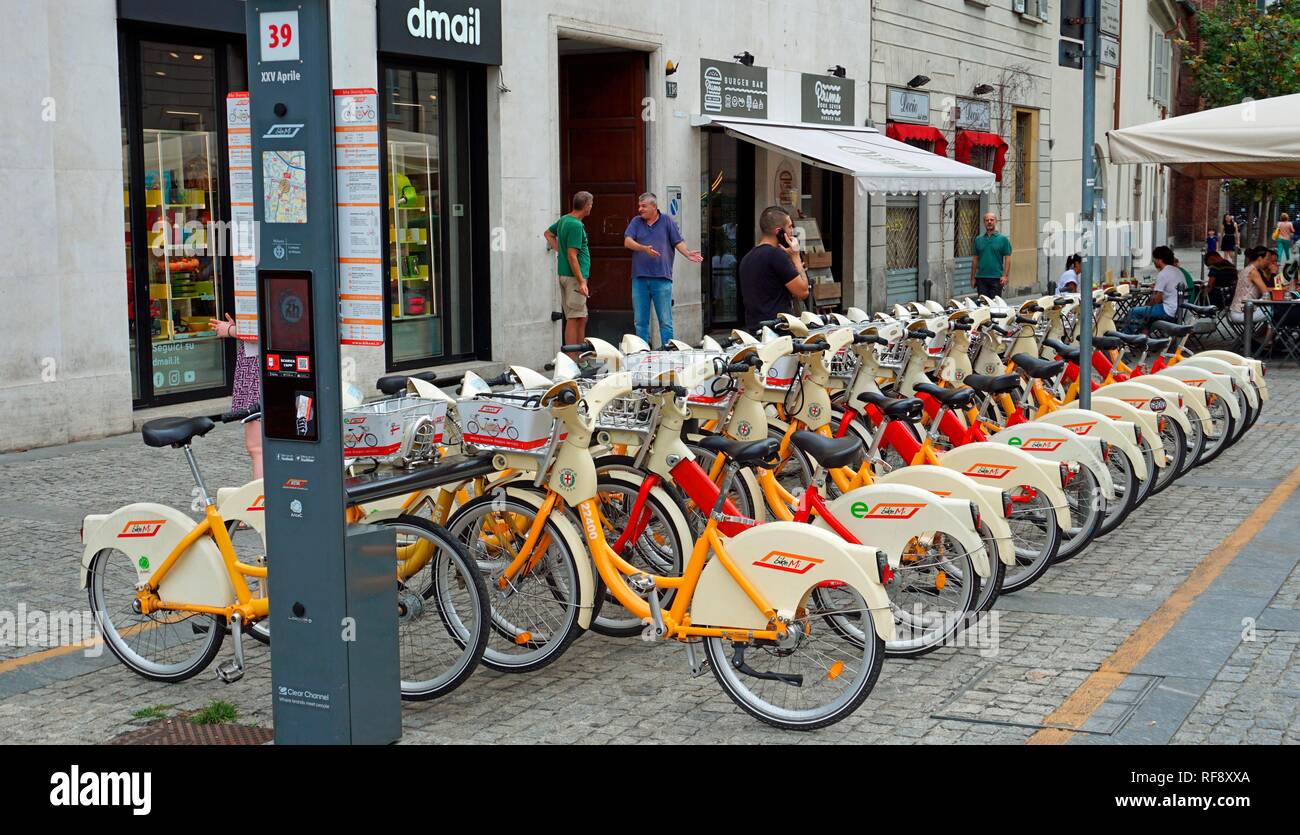 Bicycles lined up at a rental bike station in the centre of Milan, near Corso Como, Milan, Lombardy, Italy Stock Photo