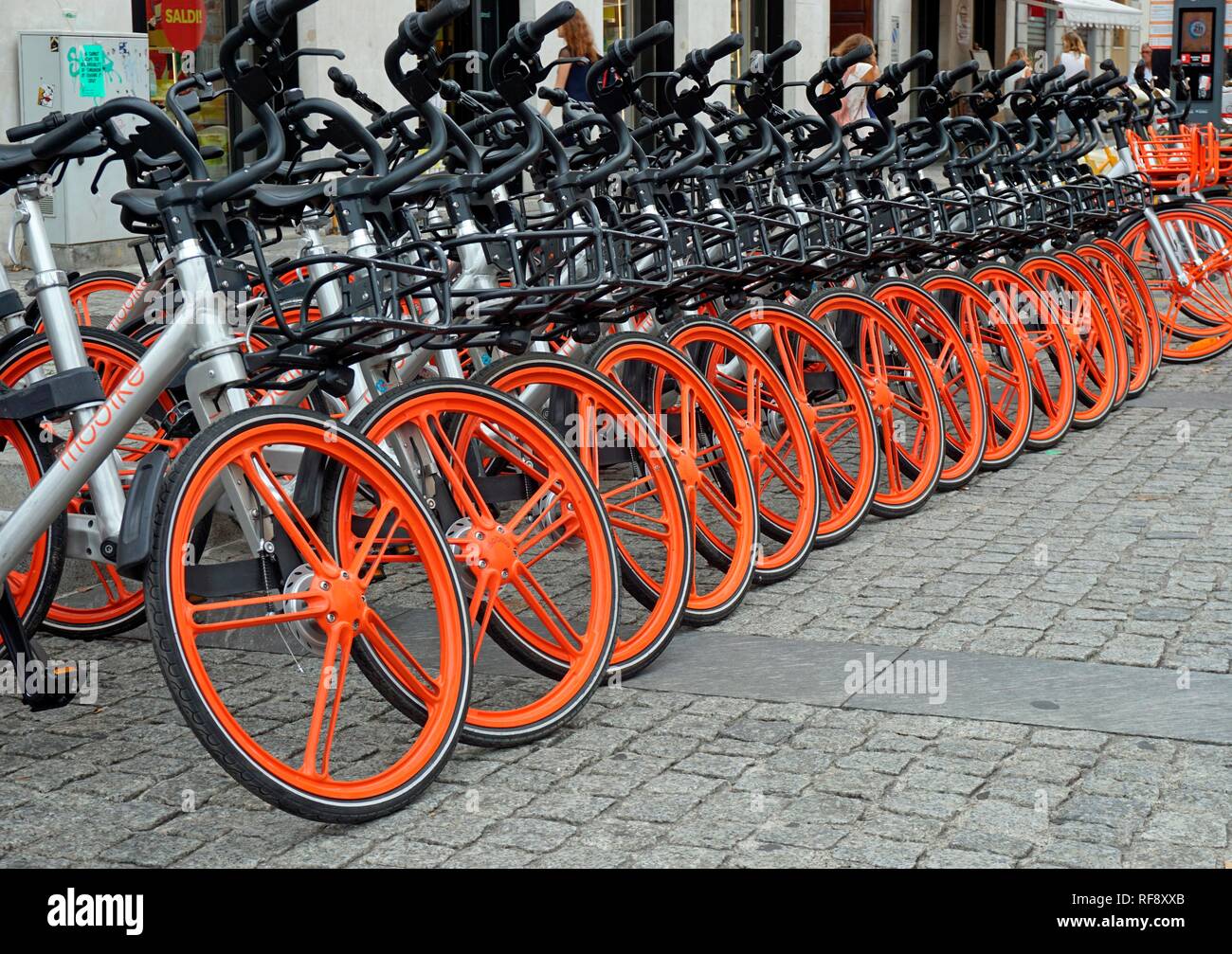 Bicycles lined up at a rental bike station in the centre of Milan, near Corso Como, Milan, Lombardy, Italy Stock Photo