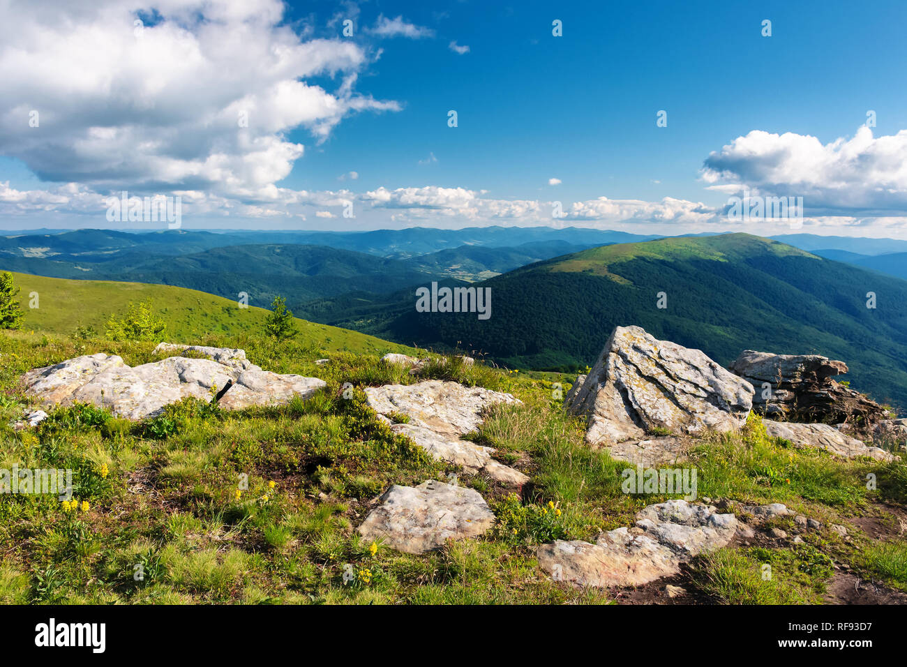 wonderful mountain landscape. beautiful view in to the distant valley. fluffy clouds on the sky. peaceful idyllic afternoon scenery Stock Photo