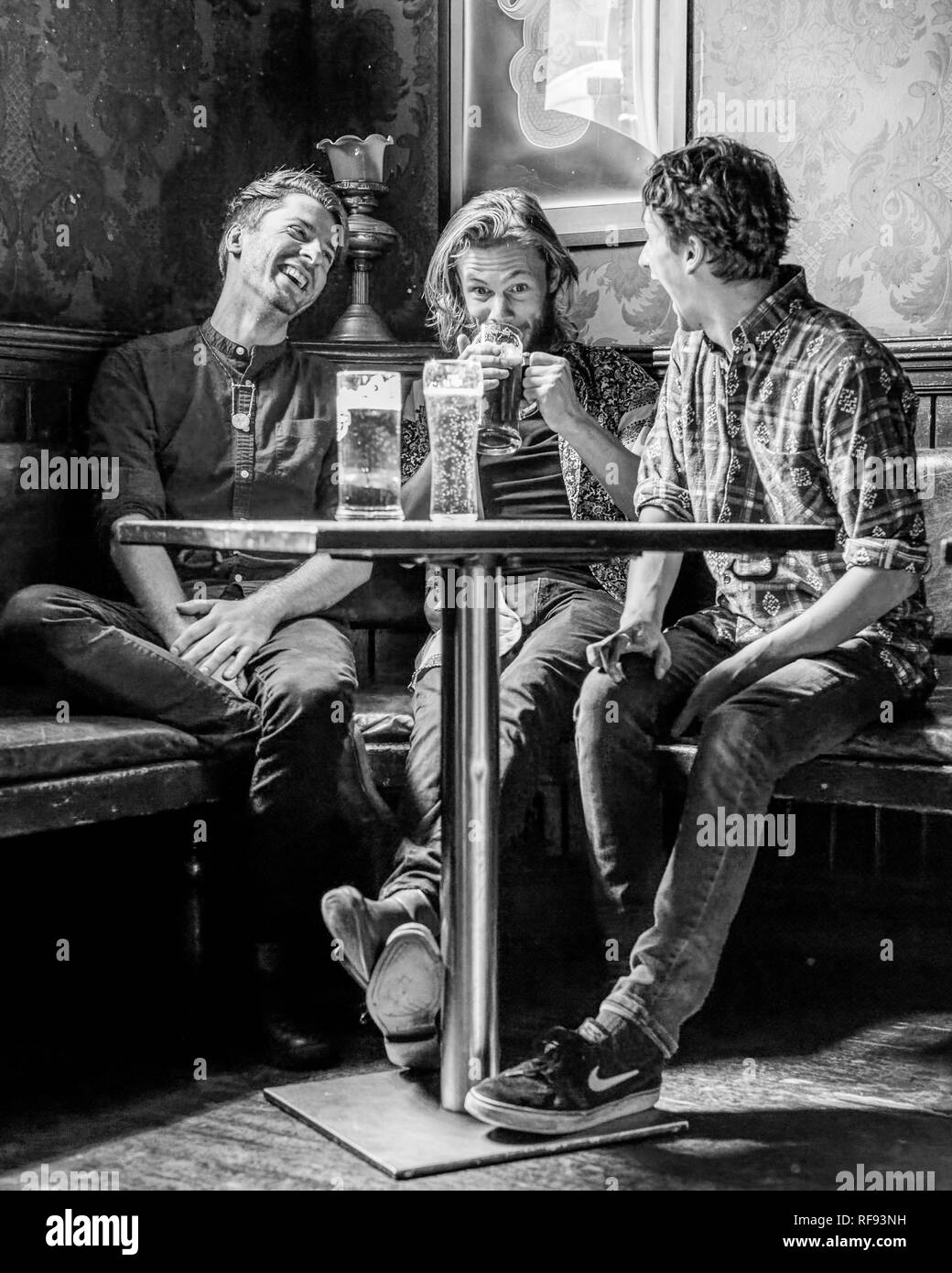 London, England, 13, September 2017, three young men at a bar or pub
