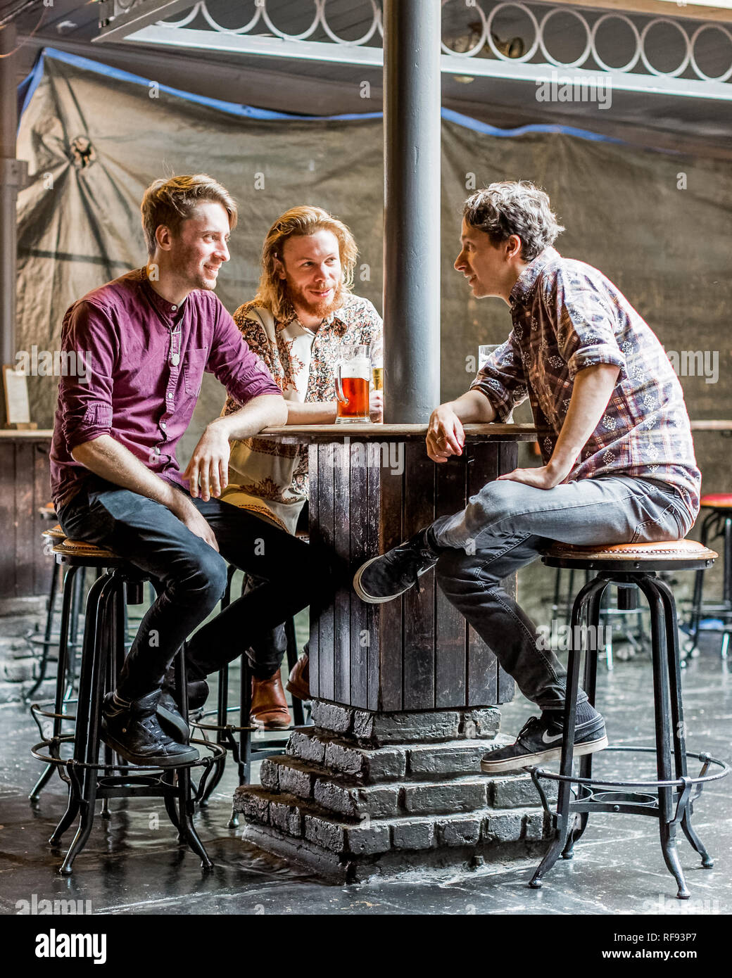 London, England, 13, September 2017, three young men at a bar or pub drinking a beer - newly opened worlds end pub - in Camden, London. Stock Photo