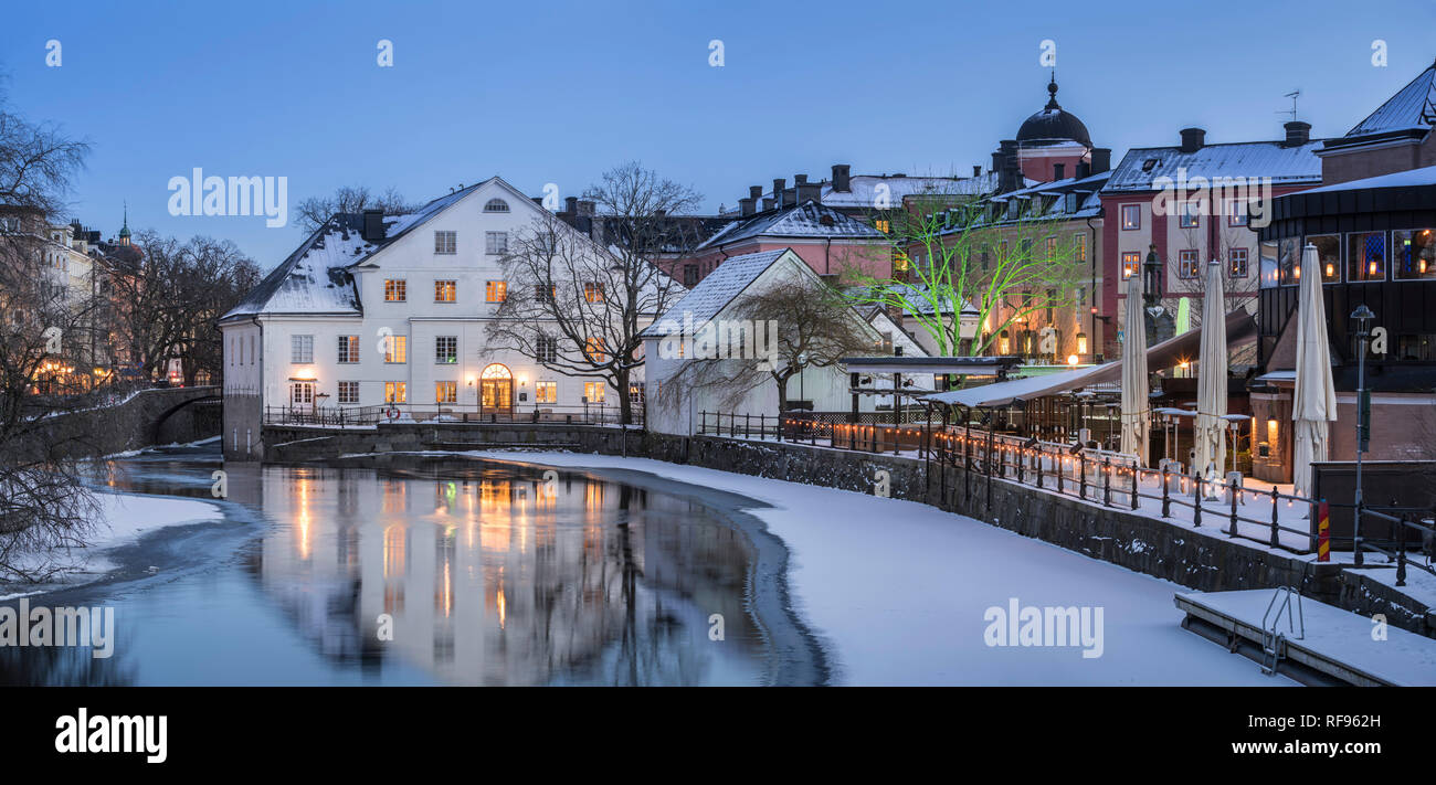 Winter night at dusk by the Fyris river in central Uppsala, Sweden, Scandinavia Stock Photo