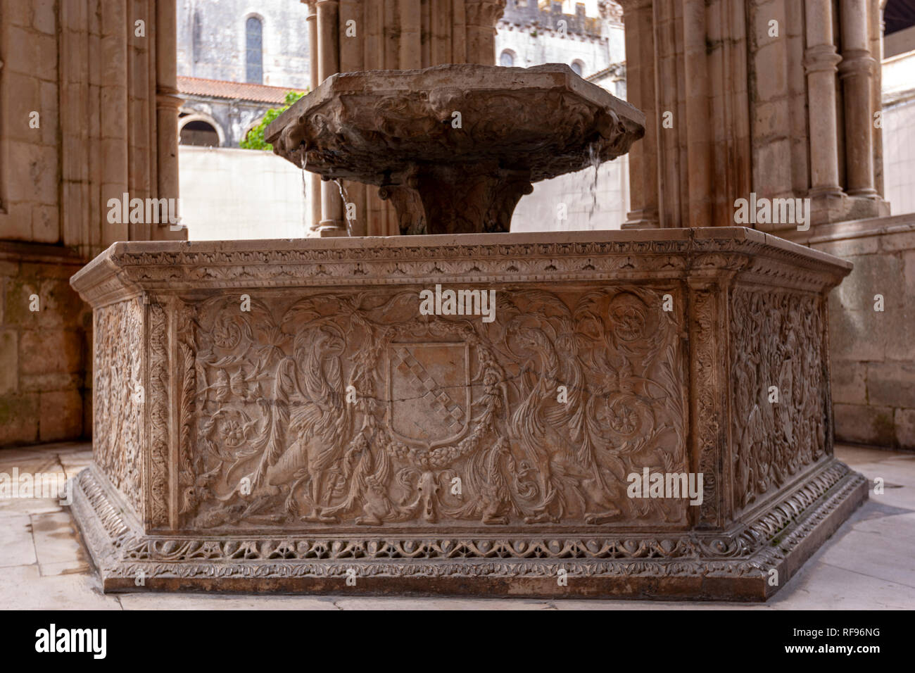 Renaissance water basin within the Gothic fountain house in the cloister of the Monastery of Alcobaça, Portugal Stock Photo