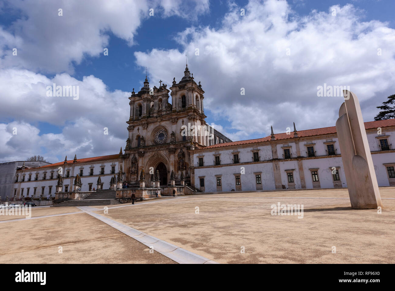 Façade of the Monastery of Alcobaça. The portal and rose window are original gothic, while the towers are baroque. Portugal Stock Photo
