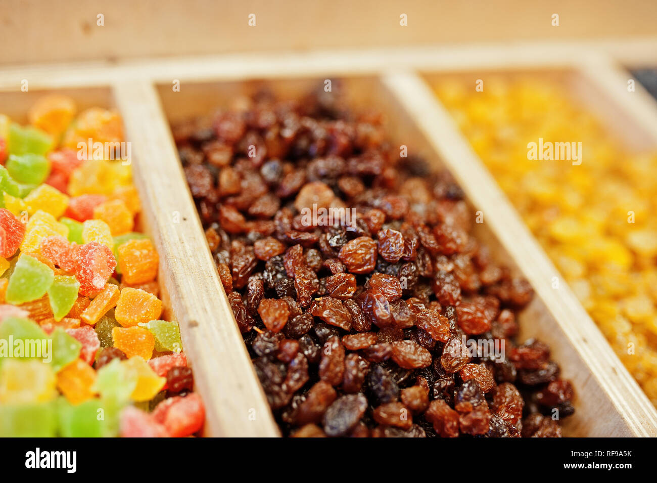 Raisins and candied fruits on the shelf of a supermarket or grocery