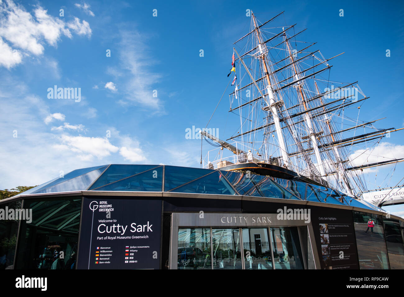 GREENWICH, UK - The Cutty Sark is a restored historic British clipper sailing ship that is now open as a tourist attraction in Greenwich, London. It was built in 1869 and in active service until 1895. In its heyday as a trader vessel, it was known as the fastest ship of its time. It was notable for its participation in the tea trade between Asia and Europe. When the opening of the Suez Canal created the opportunity for shorter and faster trips made by steam ships, the Cutty Sark was used to transport wool from Australia to Britain. The historic Cutty Sark, a British clipper ship and one of the Stock Photo