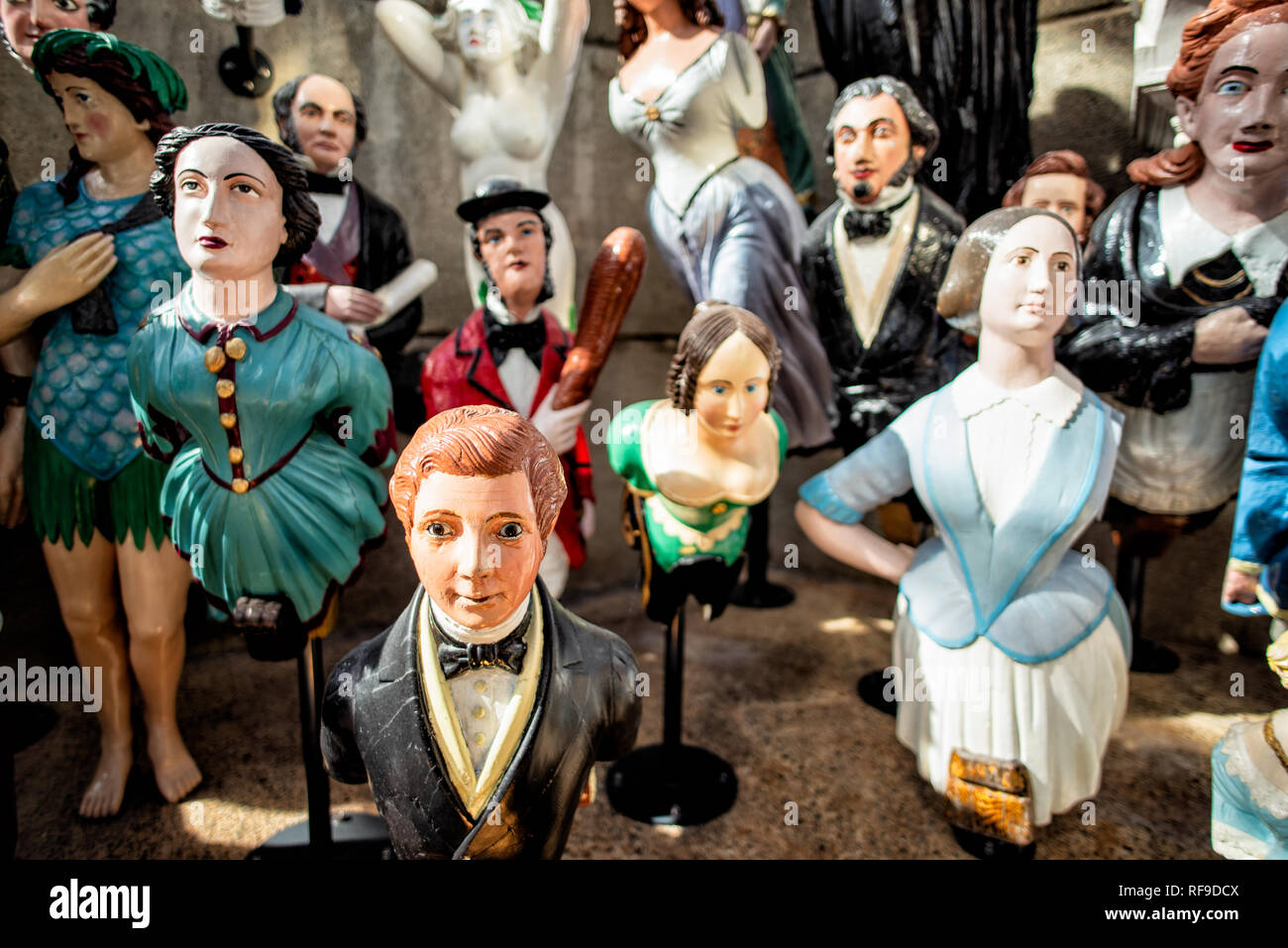 GREENWICH, UK - Figureheads on display at the Cutty Sark Museum in Greenwich, London. The Cutty Sark is a restored historic British clipper sailing ship that is now open as a tourist attraction in Greenwich, London. It was built in 1869 and in active service until 1895. In its heyday as a trader vessel, it was known as the fastest ship of its time. It was notable for its participation in the tea trade between Asia and Europe. When the opening of the Suez Canal created the opportunity for shorter and faster trips made by steam ships, the Cutty Sark was used to transport wool from Australia to B Stock Photo