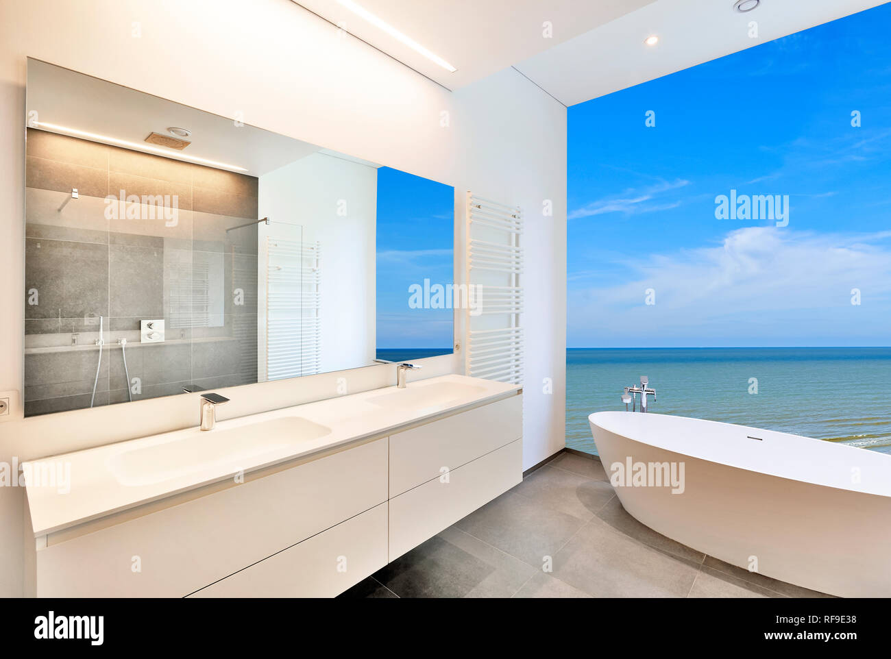 Bathtub In Corian Faucet And Shower In Tiled Bathroom With Ocean