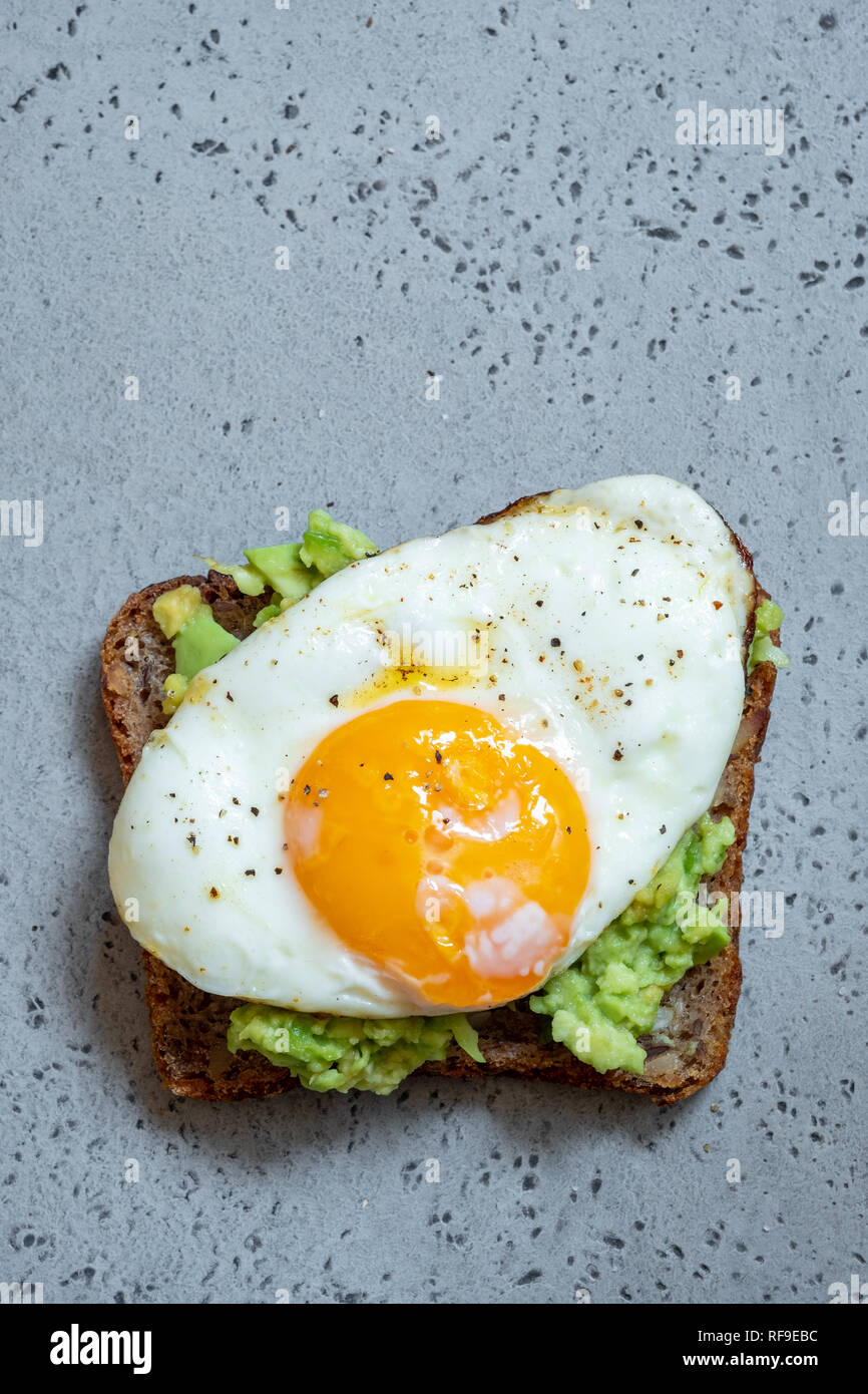 Avocado toast with Egg for healthy breakfast Stock Photo - Alamy