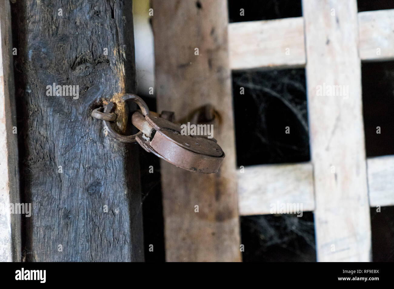 Retro padlock on a wooden fence Stock Photo