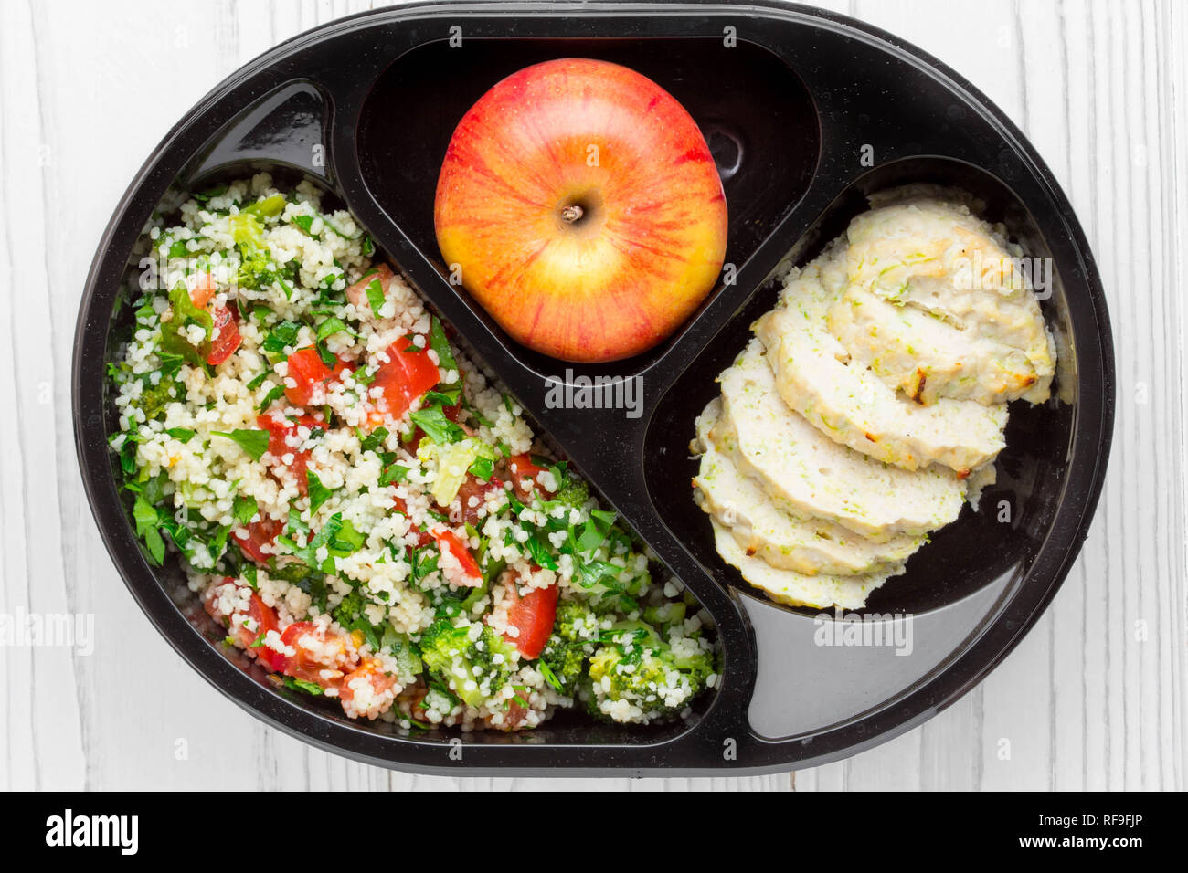 Lunch box with healthy, diet food, chicken, couscous with vegetables