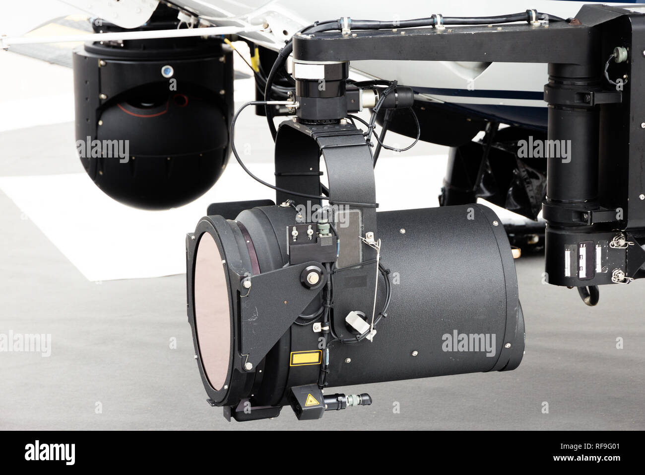 Police helicopter search light and camera pod Stock Photo Alamy