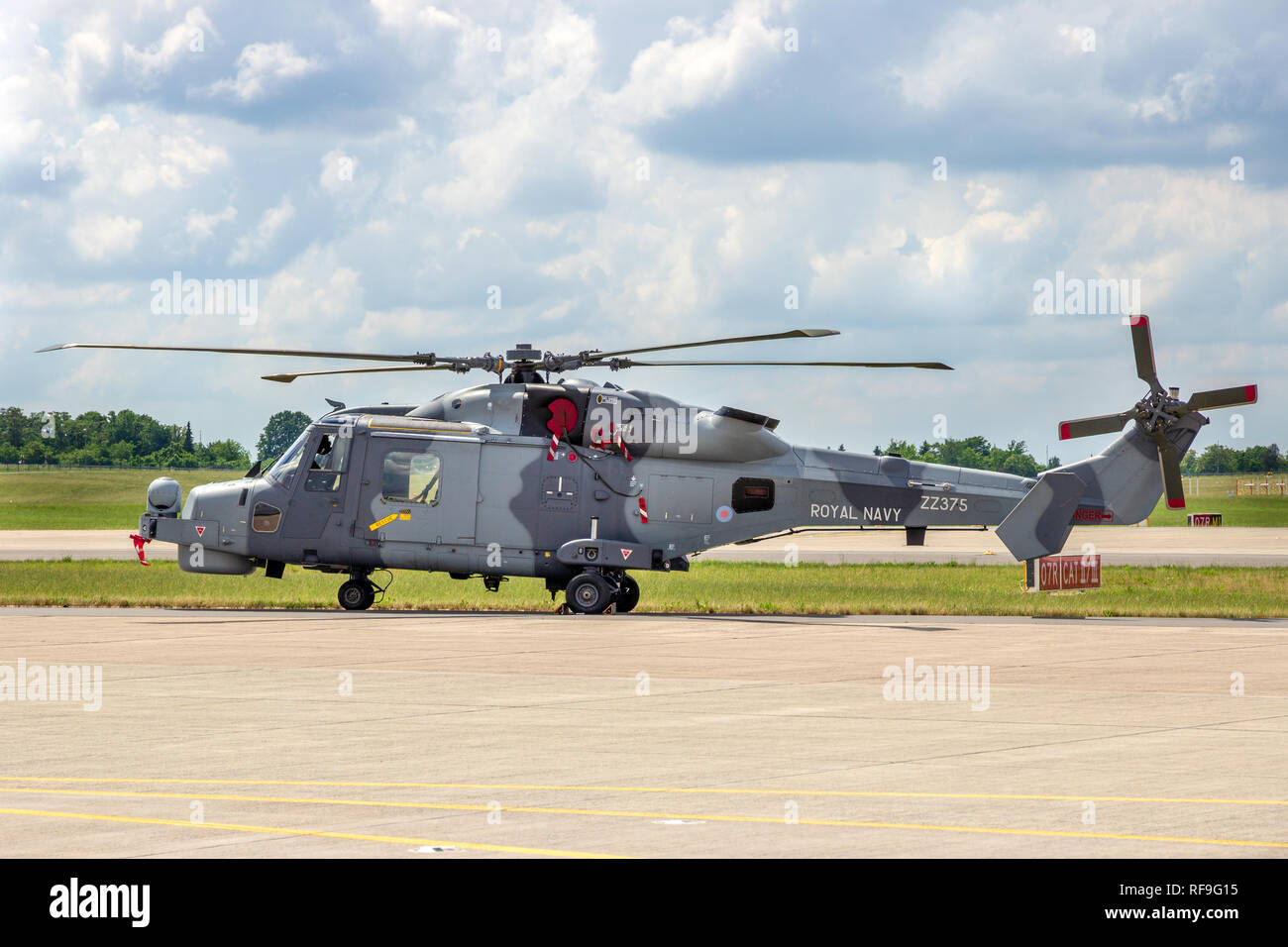 BERLIN - JUN 2, 2016: British Royal Navy Wildcat helicopter on the tarmac of Berlin-Schoneveld airport. Stock Photo