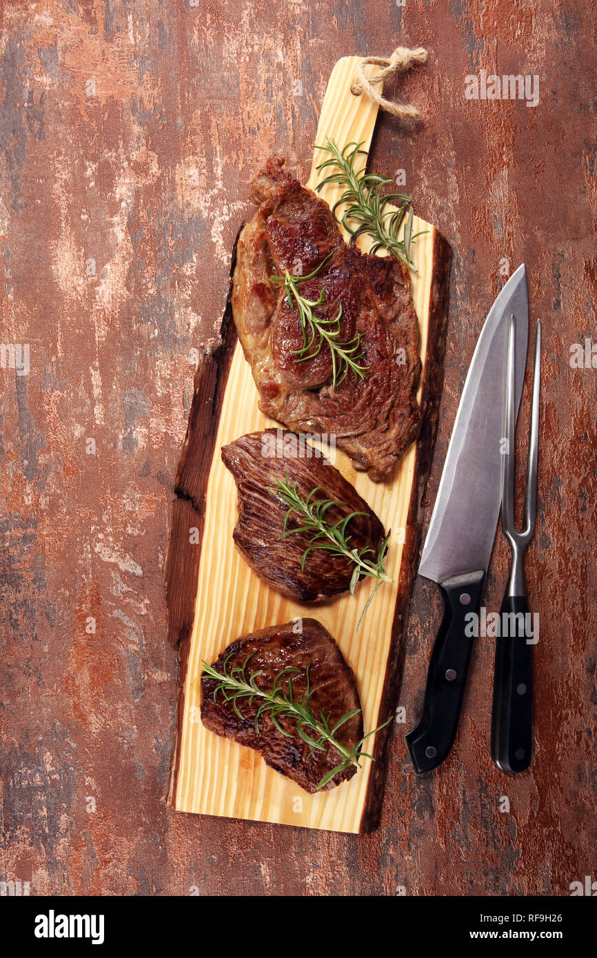 Barbecue Rib Eye Steak. Black Angus Prime meat steaks Machete, Striploin, Rib eye, Tenderloin fillet mignon Stock Photo