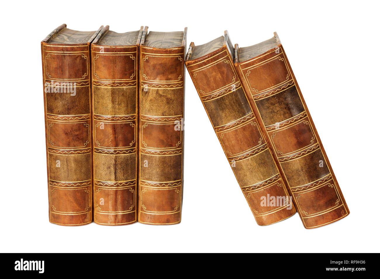 Row of antique books in a leather hardcover isolated on white background Stock Photo
