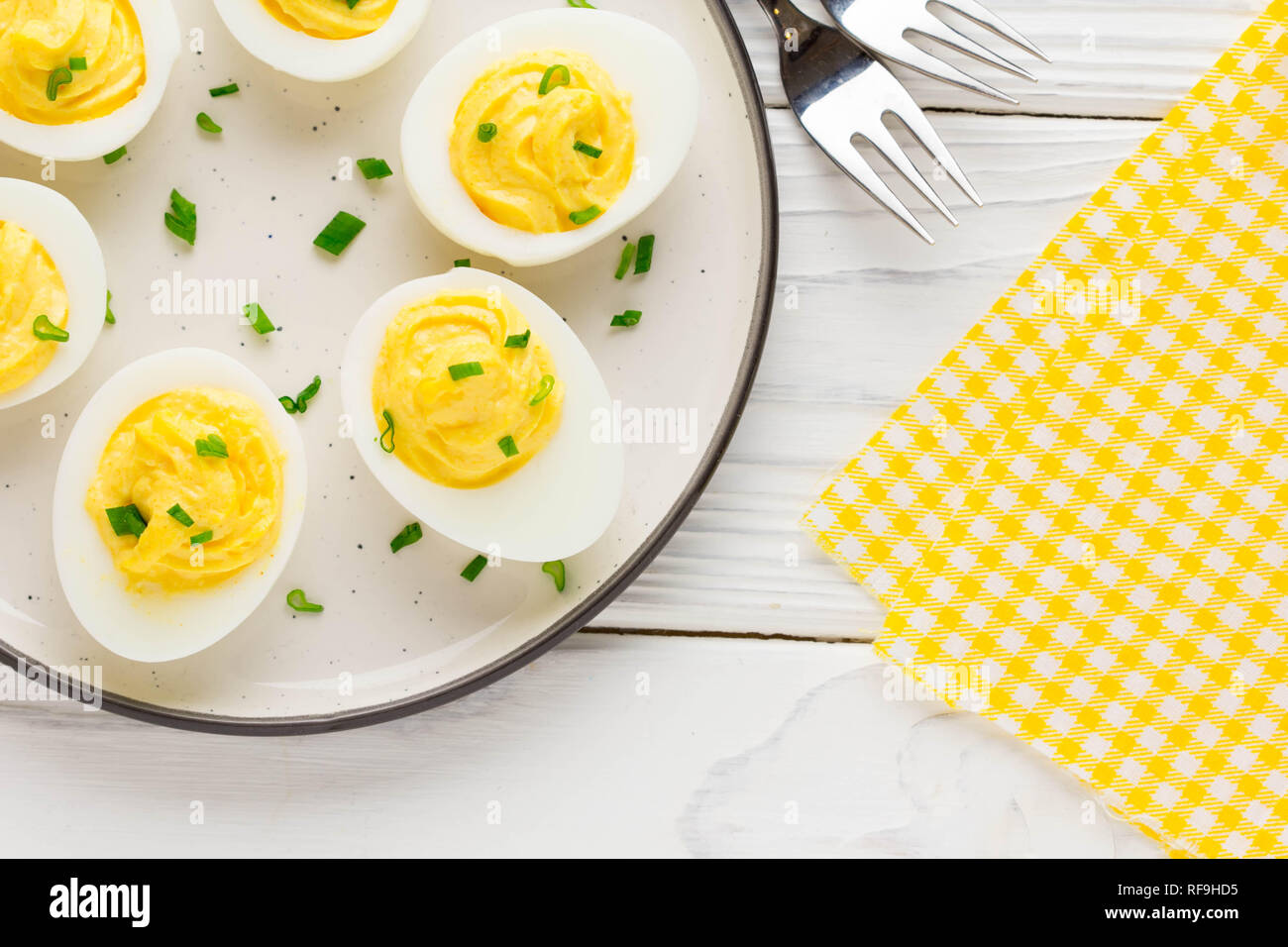 Stuffed eggs, yellow mousse, wine snack, holiday party Stock Photo Alamy