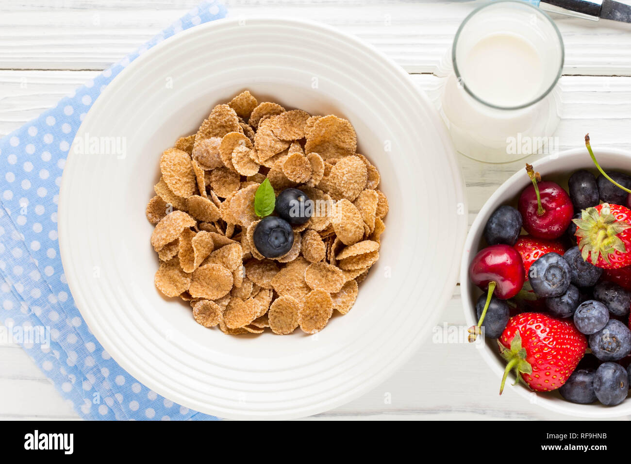 Multi-slag flakes for Breakfast with berries and milk, muesli, corn Stock Photo